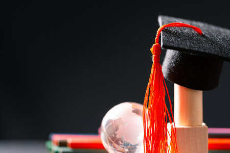 Concept education is business scholarship essential idea globalization, mortarboard students learn and study in universities and colleges master knowledge save involves financial management diplomaの写真素材