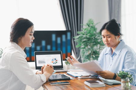 People meeting using laptop computer, calculator, stock market chart paper for analysis plans to improve quality. Team working on project. Analysis business brainstorming corporate smart Concept.の写真素材
