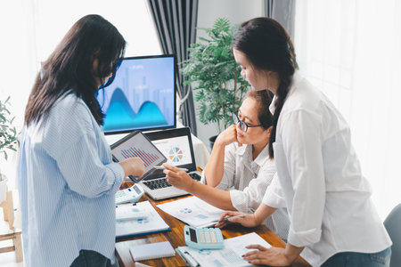 Teamwork with business people analysis cost graph on desk at meeting room. partnership analysis graph company financial budget report, cost work progress planning, business team analysis graph dataの写真素材