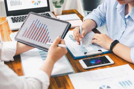 Teamwork meeting, business people in office workplace. Collaboration, technology and worker, employees with touchscreen planning sales, research or financial strategy, staff for conversation, graphの写真素材
