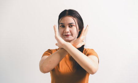 Asian girl expresses dislike, person express negative feeling, concept business complaint from customer ensuring employee satisfaction negative feedback to prevent mental strain customer dislikeの写真素材