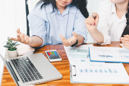 Teamwork with business people analysis cost graph on desk at meeting room. partnership analysis graph company financial budget report, cost work progress planning, business team analysis graph dataの写真素材