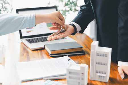 Real estate agent delivering sample home to customer, mortgage loan contract. Contract for hire purchase sale of house. home insurance contract, home mortgage loan concept. real estate, customerの写真素材