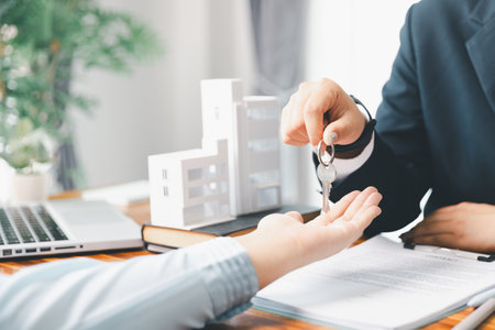 Real estate agent delivering sample home to customer, mortgage loan contract. Contract for hire purchase sale of house. home insurance contract, home mortgage loan concept. real estate, customerの写真素材
