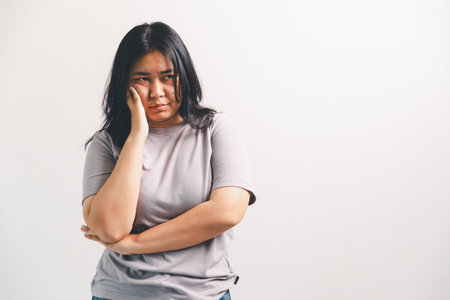 Asian girl expresses dislike, person express negative feeling, concept business complaint from...