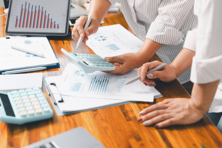 Financial business team in office, financial expert analyze business report graph and finance chart at corporate office. Concept of finance economy, banking business and stock market research.の写真素材