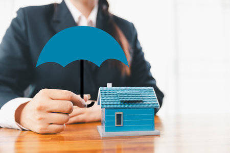 Home insurance and security concept. Real estate house insurance. Domino chain challenge risk. insurance risk management, property security, financial planning to safety, mortgage protect investmentの写真素材