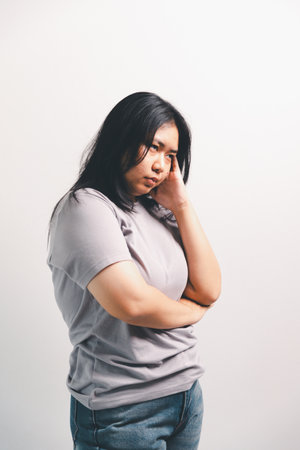 Asian girl expresses dislike, person express negative feeling, concept business complaint from customer ensuring employee satisfaction negative feedback to prevent mental strain customer dislikeの写真素材