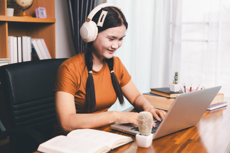 Homeschool Asian girl student learning virtual internet online class from school teacher by remote meeting. Female teaching math by headphone. education concept. student with computer study at schoolの写真素材