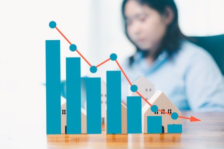 Property price. falling interest on mortgage. reduction in demand for purchase of house. low energy efficiency, low prices for public utilities. arrow down. Mortgage interest rates and arrow to downの写真素材