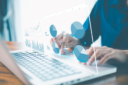 Digital age, business on technology, data science and strategy to analyze each datum charts, graphs, reports stored in database, accessed via laptop, enhancing system performance, decision making.の写真素材