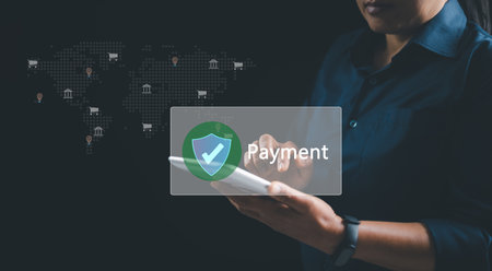 Woman using digital tablet for online payment with secure transaction, digital wallet system and mobile banking concept for financial technology, e-commerce and global money transfer. payment online.の写真素材