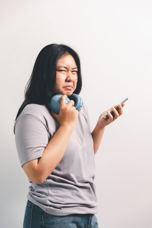 Asian girl expresses dislike, person express negative feeling, concept business complaint from customer ensuring employee satisfaction negative feedback to prevent mental strain customer dislikeの写真素材