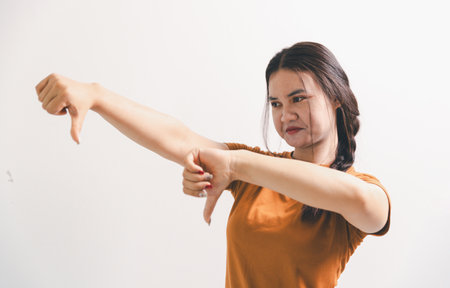 Asian girl expresses dislike, person express negative feeling, concept business complaint from...