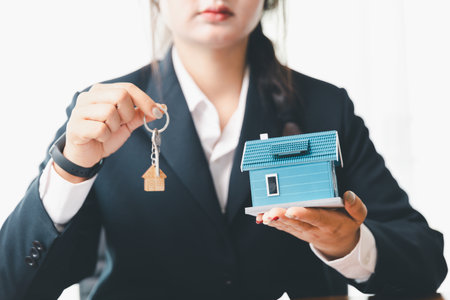 Real estate agents bid home in project to explain in detail to clients. Explain and present information about home and mortgage purchases. real estate trading concept. Real estate trading, buy, sellの写真素材