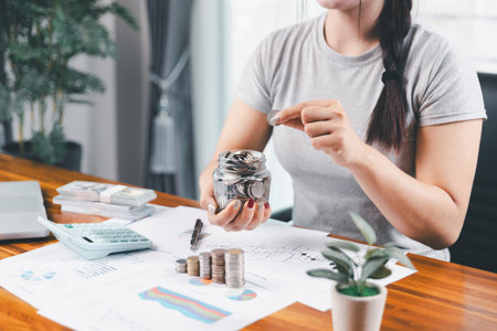 Young Asian woman making stack of coin. invest save finance concept, saving money, investment....