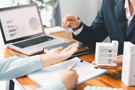 Real estate agent delivering sample home to customer, mortgage loan contract. Contract for hire purchase sale of house. home insurance contract, home mortgage loan concept. real estate, customerの写真素材