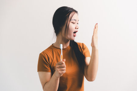 Asian girl expresses dislike, person express negative feeling, concept business complaint from customer ensuring employee satisfaction negative feedback to prevent mental strain customer dislikeの写真素材