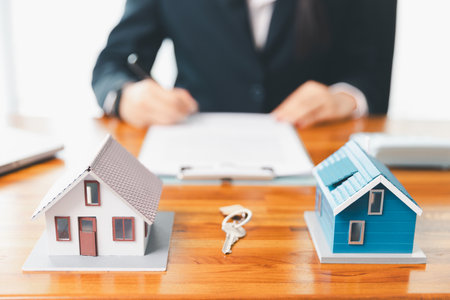 Real estate agent delivering sample home to customer, mortgage loan contract. Contract for hire purchase sale of house. home insurance contract, home mortgage loan concept. real estate, customerの写真素材