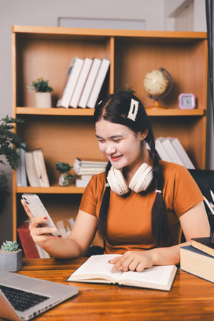 Homeschool Asian girl student learning virtual internet online class from school teacher by remote meeting. Female teaching math by headphone. education concept.の写真素材