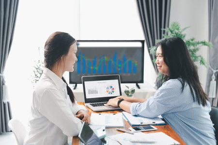 People meeting using laptop computer, calculator, stock market chart paper for analysis plans to improve quality. Team working on project. Analysis business brainstorming corporate smart Concept.の写真素材