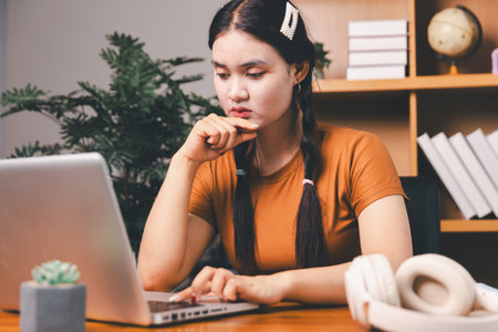Homeschool Asian girl student learning virtual internet online class by remote meeting. Female teaching math by headphone. education concept. student with computer studyの写真素材