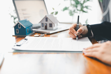 Real estate agent delivering sample home to customer, mortgage loan contract. Contract for hire purchase sale of house. home insurance contract, home mortgage loan concept. real estate, customerの写真素材