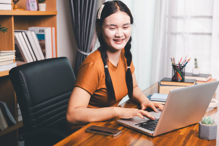 Homeschool Asian girl student learning virtual internet online class from school teacher by remote meeting. Female teaching math by headphone. education concept. student with computer study at schoolの写真素材