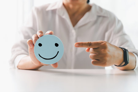Client show feedback, smiley face sign. Service rating, satisfaction concept. happy smile face, good feedback rating, positive customer review, experience, satisfaction survey, smiley mental health.の写真素材