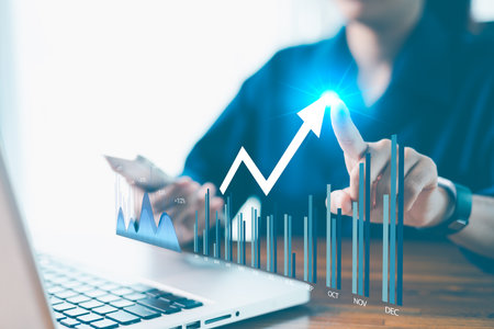 Modern technology in hand, businesses harness data, statistics and graphs to drive financial analysis and progress. technology, statistic, data, analysis, modern, progress, business, financial, graphの写真素材