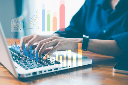 Modern technology in hand, businesses harness data, statistics and graphs to drive financial analysis and progress. technology, statistic, data, analysis, modern, progress, business, financial, graphの写真素材