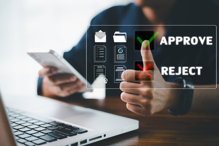 Digital interface designed for business automation, concept of document review is visualized by finger pressing green check mark icon, symbolizing approval or rejection ideal decision making workflowの写真素材