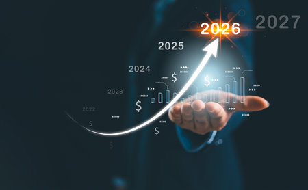 Businesswoman hand holding glowing upward arrow with financial timeline 2022â2027, symbolizing business forecast, investment growth, financial planning, profit and future success.の写真素材