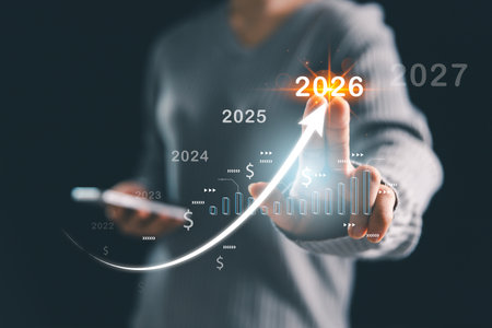 Businesswoman hand pointing glowing upward arrow with financial timeline 2022â2027, symbolizing business forecast, investment growth, financial planning, profit and future success.の写真素材