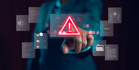 Businessman pressing digital system warning icon with data and AI elements on virtual screen, concept of cybersecurity risk, data protection, artificial intelligence, online safety and IT security.の写真素材