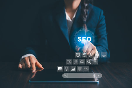 Person working on digital tablet manages search engine optimization, SEO, social media, content, advertisements boost website performance. internet business technology for promoting traffic website.の写真素材