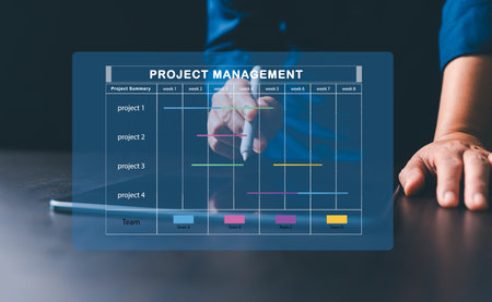 Project manager is working on virtual screen, using project management system. Gantt chart interface...