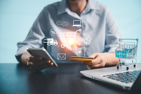 Concept of procurement technology shopper using computer or laptop for online shopping, e-commerce convenience with credit card payments, digital trolleys, fast delivery powered by modern technology.の写真素材
