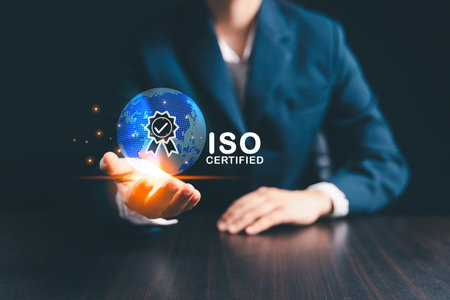 Businesswoman stands beside globe, representing modern global business practices where ISO standards, quality control, certification ensure product quality assurance, guarantee across market.の写真素材