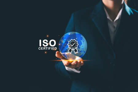 Businesswoman stands beside globe, representing modern global business practices where standards, quality control, certification ensure product quality assurance, guarantee across market.の写真素材