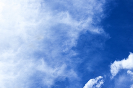 A beautiful background of a blue sky with cloudsの写真素材