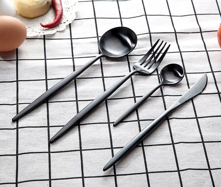 Black utensil set on the plate.