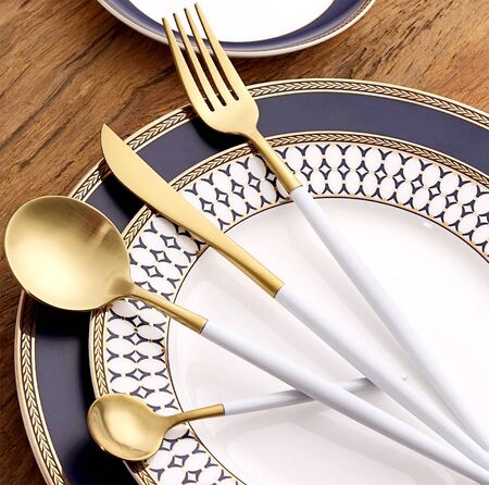 Golden spoon set on the plate.の写真素材