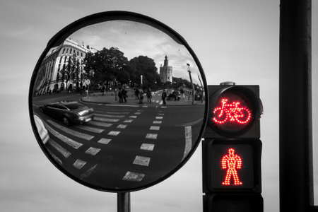 Red traffic light for pedestrians with the reflection of a monumentの写真素材