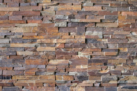 Flagstone bricks form an abstract pattern around a fireplace 