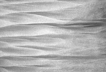 Sand and sea interact along the Mexican Pacific coast in Mazatlan to create an abstract pattern の写真素材