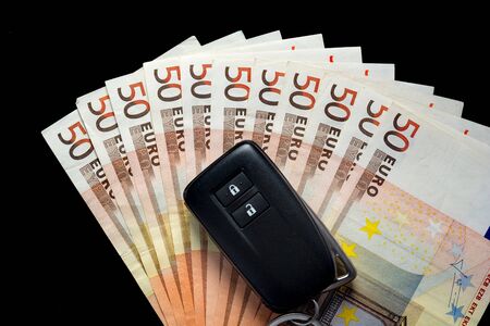 Key car on several 50 euro notes. Buy a car conceptの写真素材