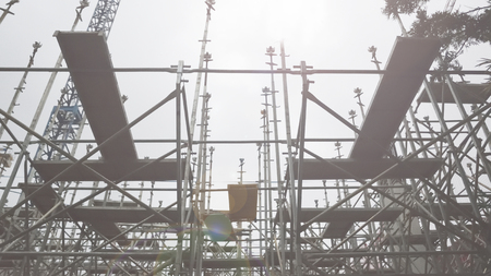 Scaffold structure from below. Sun light and empty copy space for Editor's text.の写真素材