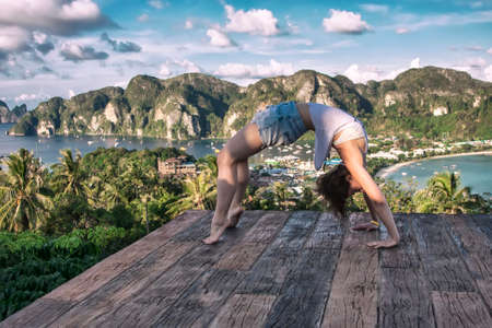 young woman doing yogaの写真素材