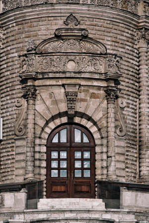 Old wooden door at the entrance to the old churchの写真素材